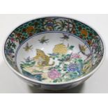 A c.1900 Chinese porcelain bowl featuring cat, bir
