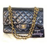 A ladies Chanel handbag with certificate card & or