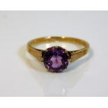 A 9ct gold ring set with amethyst colour stone 1.8