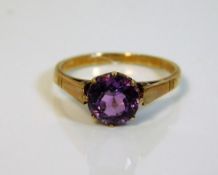 A 9ct gold ring set with amethyst colour stone 1.8