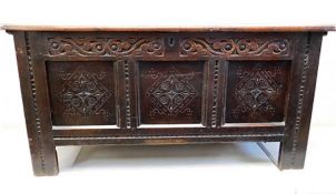 A good, early 17thC. oak coffer with carved decor