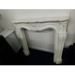 A decorative cast fire surround