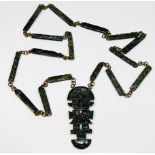 A jade necklace with Aztec style figure 25in long