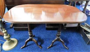 A twin pedestal mahogany occasional table 36in lon