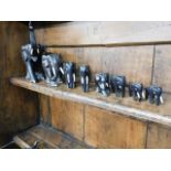 A set of eight graduated elephants