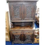 A c.1800 carved oak Dutch dresser with figurative