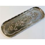 A small silver tray with embossed décor P.H. Vogel