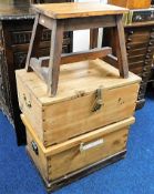 Two robust storage trunks twinned with a rustic mi