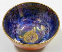 A Wedgwood lustreware dish with gilded animal deco