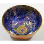 A Wedgwood lustreware dish with gilded animal deco