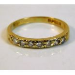 An 18ct gold half eternity ring set with seven dia