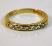 An 18ct gold half eternity ring set with seven dia