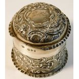 A silver embossed pot & cover, loss to top rim, Lo