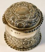 A silver embossed pot & cover, loss to top rim, Lo