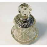 A silver collared scent bottle