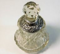 A silver collared scent bottle