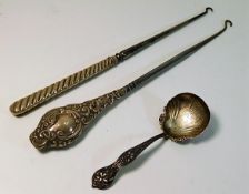 Two silver handled implements twinned with a decor