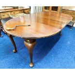 A 19thC. mahogany extending table with winder & in