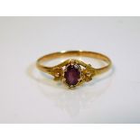 An antique ring set with possibly a pink sapphire