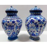 Two 19thC. lidded Persian earthenware jars, both l
