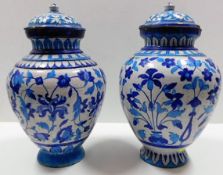 Two 19thC. lidded Persian earthenware jars, both l