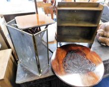 A small bookcase twinned with a carved table top d