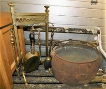 A Kenrick cast pot & a brass companion set with ra