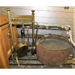 A Kenrick cast pot & a brass companion set with ra