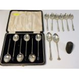A set of six unboxed silver spoons, two other silv