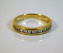 An 18ct gold half eternity ring set with 0.5ct dia