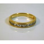 An 18ct gold half eternity ring set with 0.5ct dia