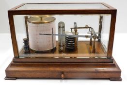 A 1914 oak cased barograph. Provenance: From Grade