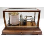 A 1914 oak cased barograph. Provenance: From Grade