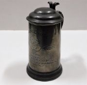 A pewter stein inscribed "Queens College Scratch F