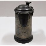 A pewter stein inscribed "Queens College Scratch F