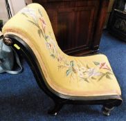 A Victorian sleigh shaped lacquered nursing chair