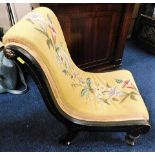 A Victorian sleigh shaped lacquered nursing chair