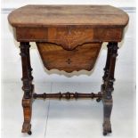 A mid 19thC. walnut work table with lined & fretwo
