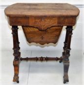 A mid 19thC. walnut work table with lined & fretwo