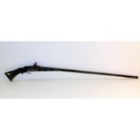 A 19thC. Asian, probably Indian, flintlock rifle 6