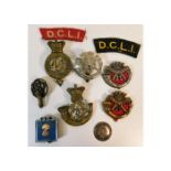 A quantity of DCLI & other regiment badges includi