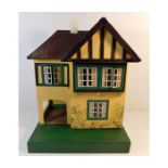 A vintage Triang dolls house approx. 17in tall x 1