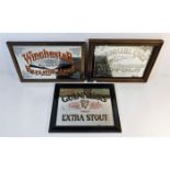 Two framed gun mirrors, Colt & Winchester twinned