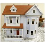 A large American style dolls house 35.5in high x 3