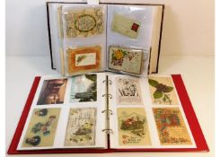 A vintage postcard album, mostly greetings cards,