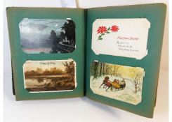 A vintage postcard album, mostly greetings cards a