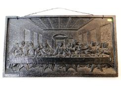 A 19thC. cast iron plaque of Jesus "The Last Suppe