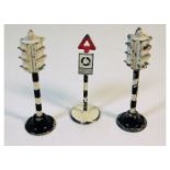 Three Dinky diecast toy road signs