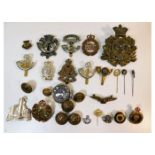 A quantity of mixed military badges including Wome