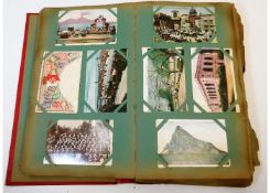 A vintage early 20thC. postcard album, approx. 312
